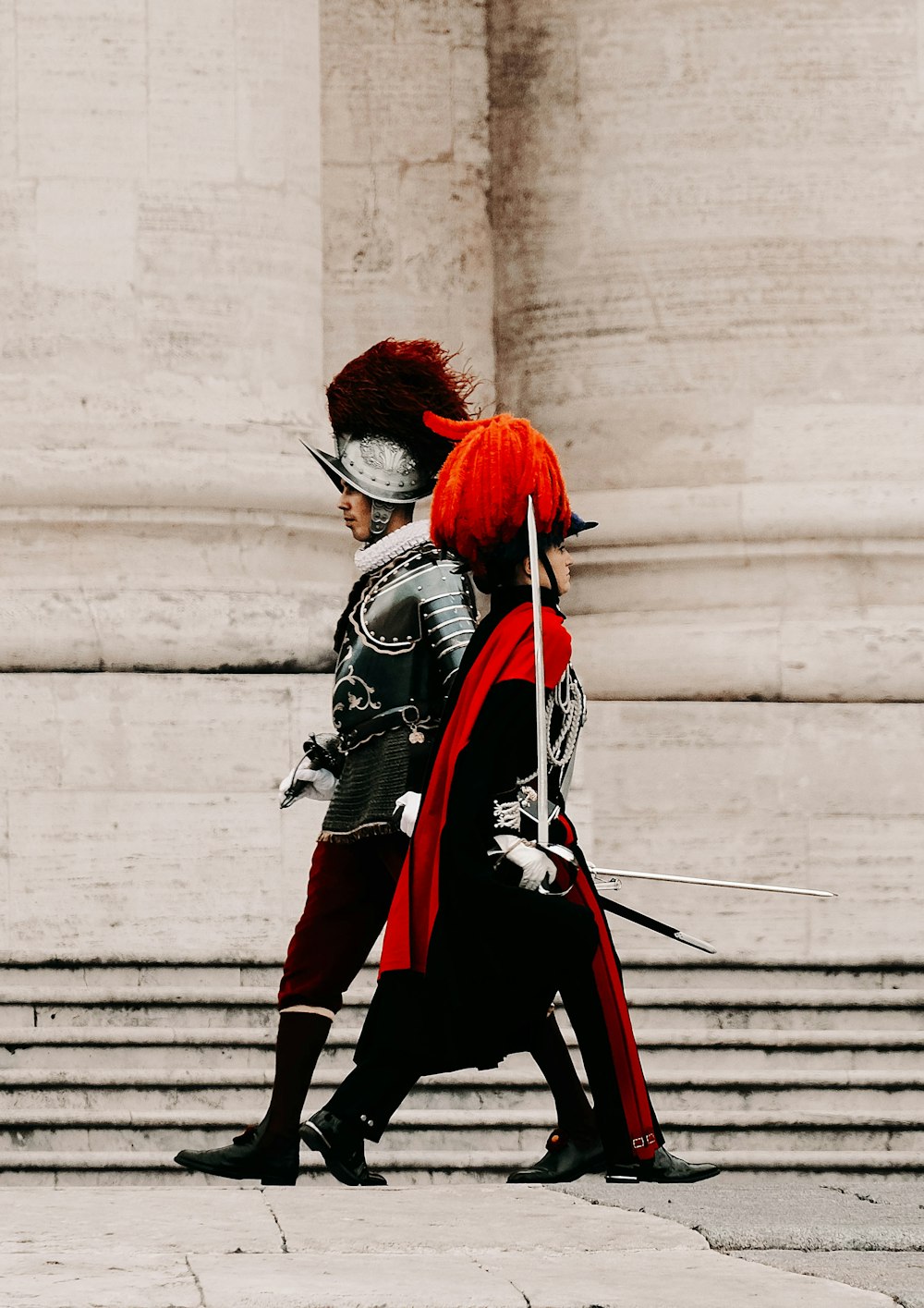 two men in costumes walking down a street