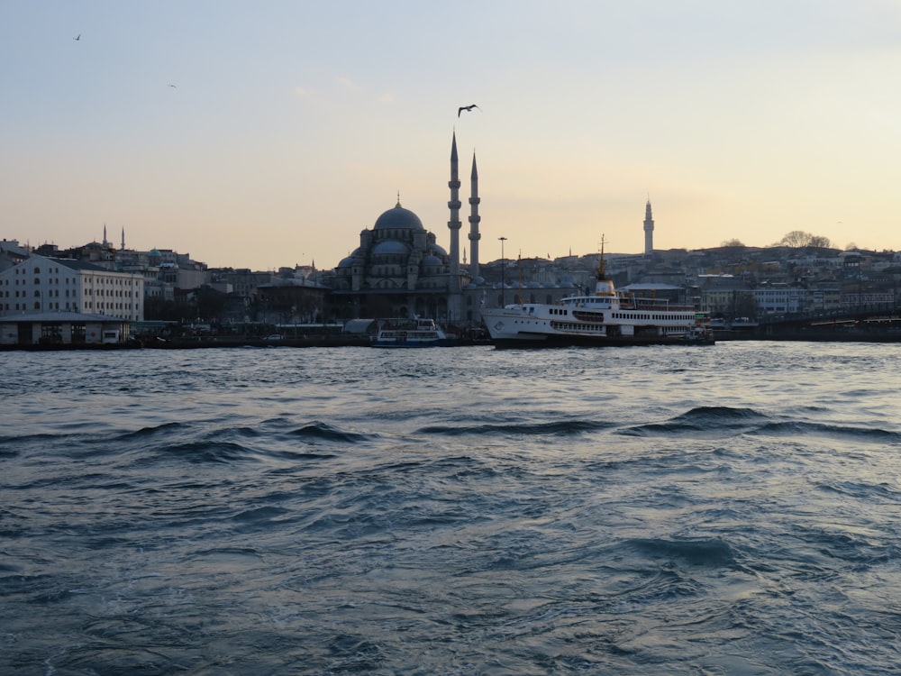 a large body of water with a large building in the background