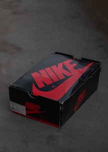 a black box with a red nike logo on it