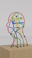 a sculpture of a man's head made of colored wires