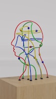 a sculpture of a man's head made of colored wires
