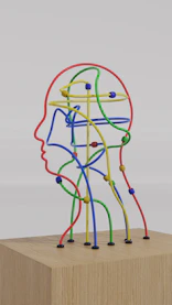 a sculpture of a man's head made of colored wires