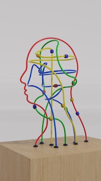 a sculpture of a man's head made of colored wires