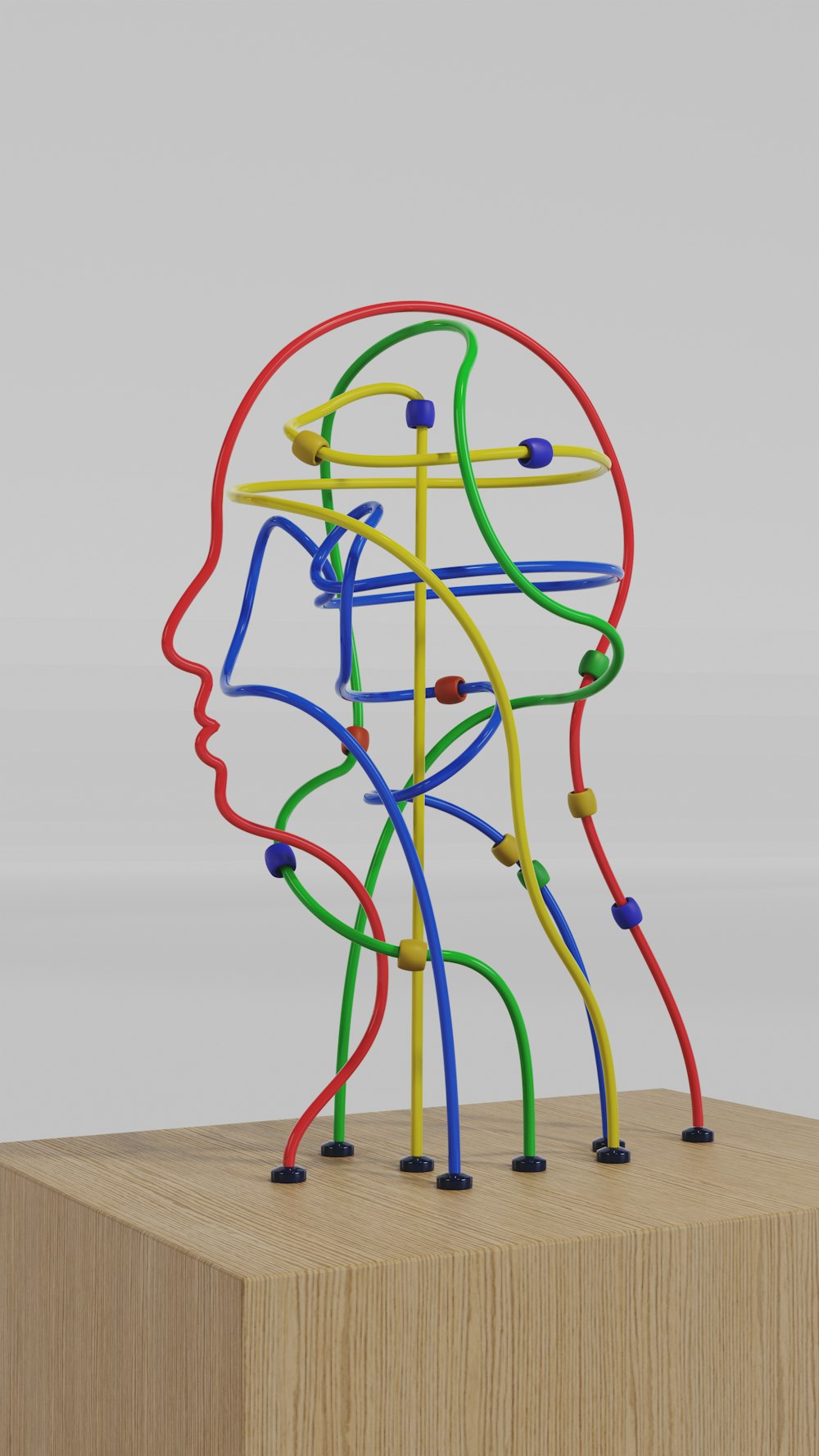 Una escultura de la cabeza de un hombre hecha de alambres de colores