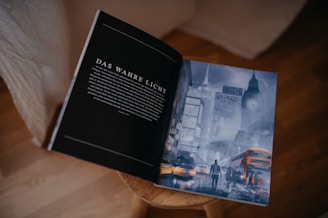 a book opened to a picture of a city