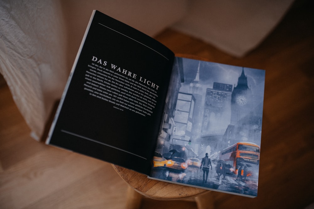 a book opened to a picture of a city