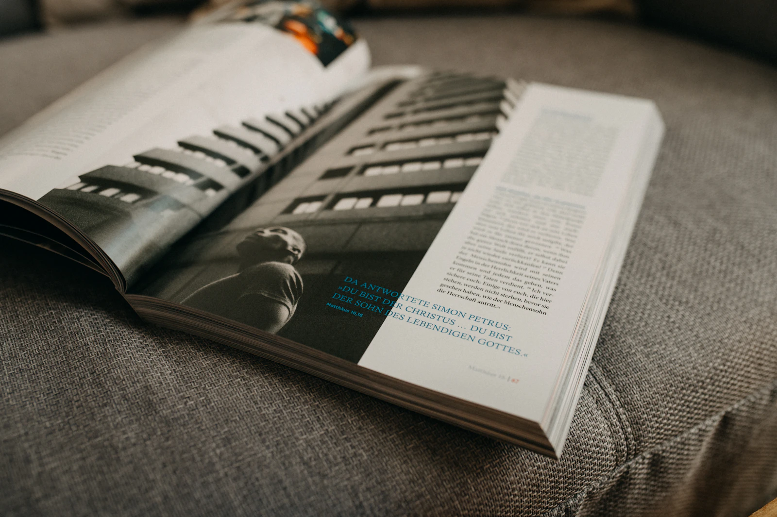 Open magazine spread with an architectural photo and editorial layout
