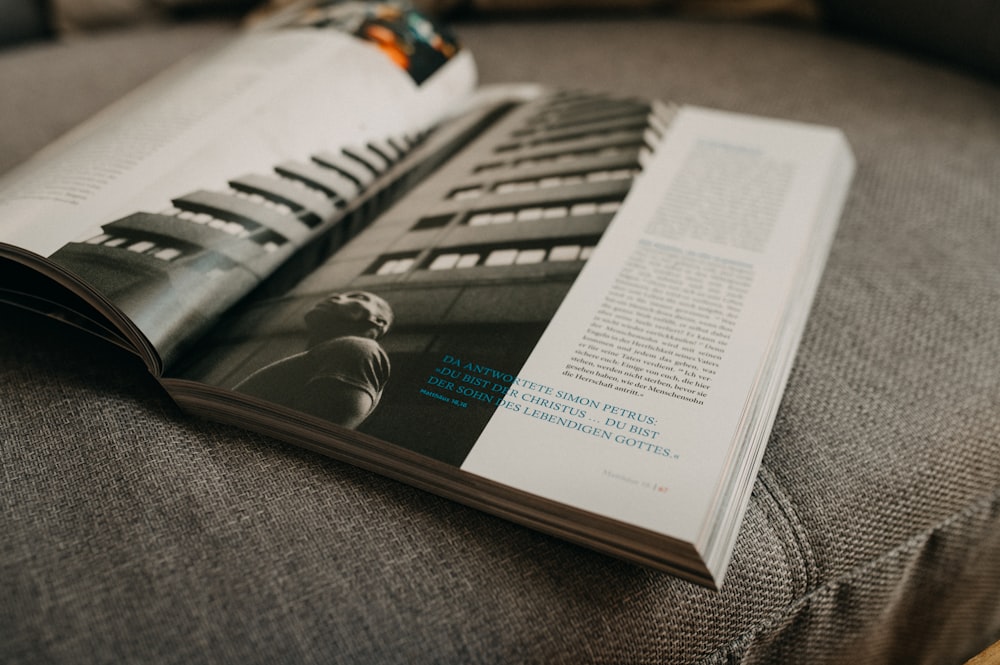 an open book sitting on top of a couch