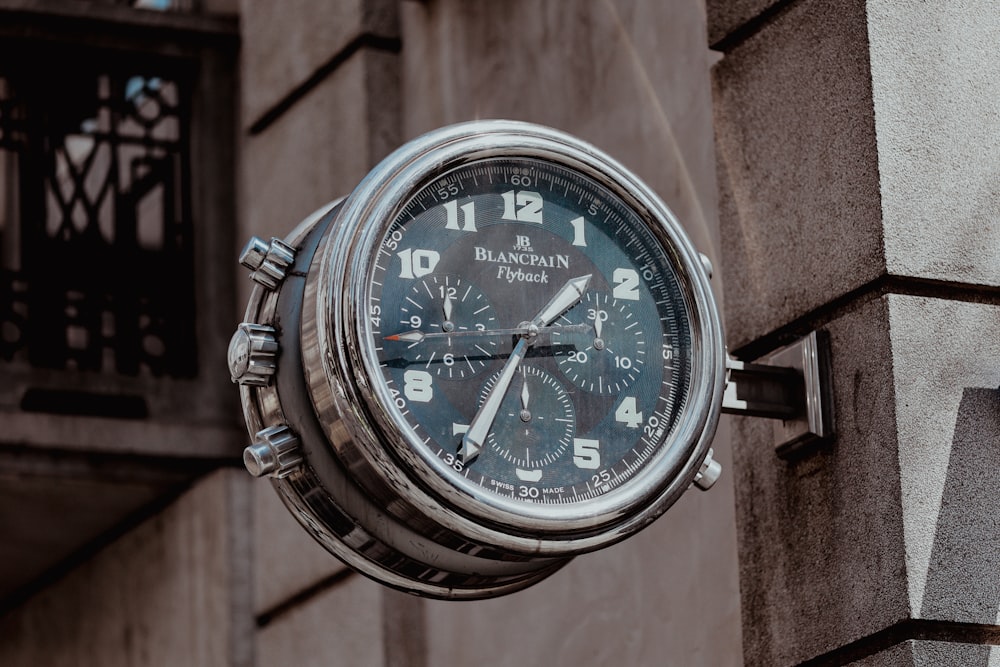 a close up of a clock on a building