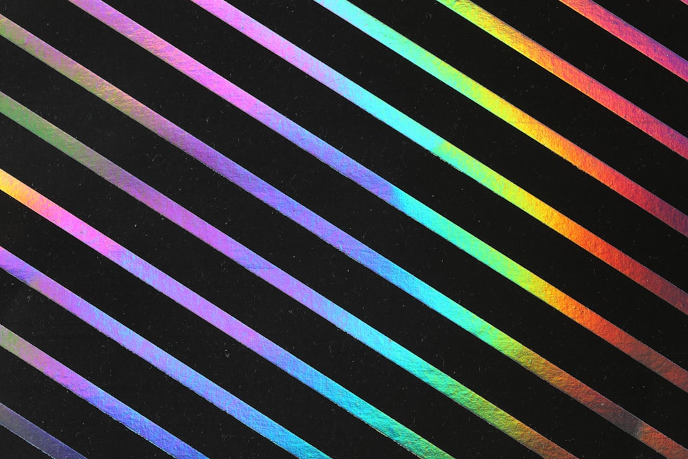 a black background with multicolored lines on it