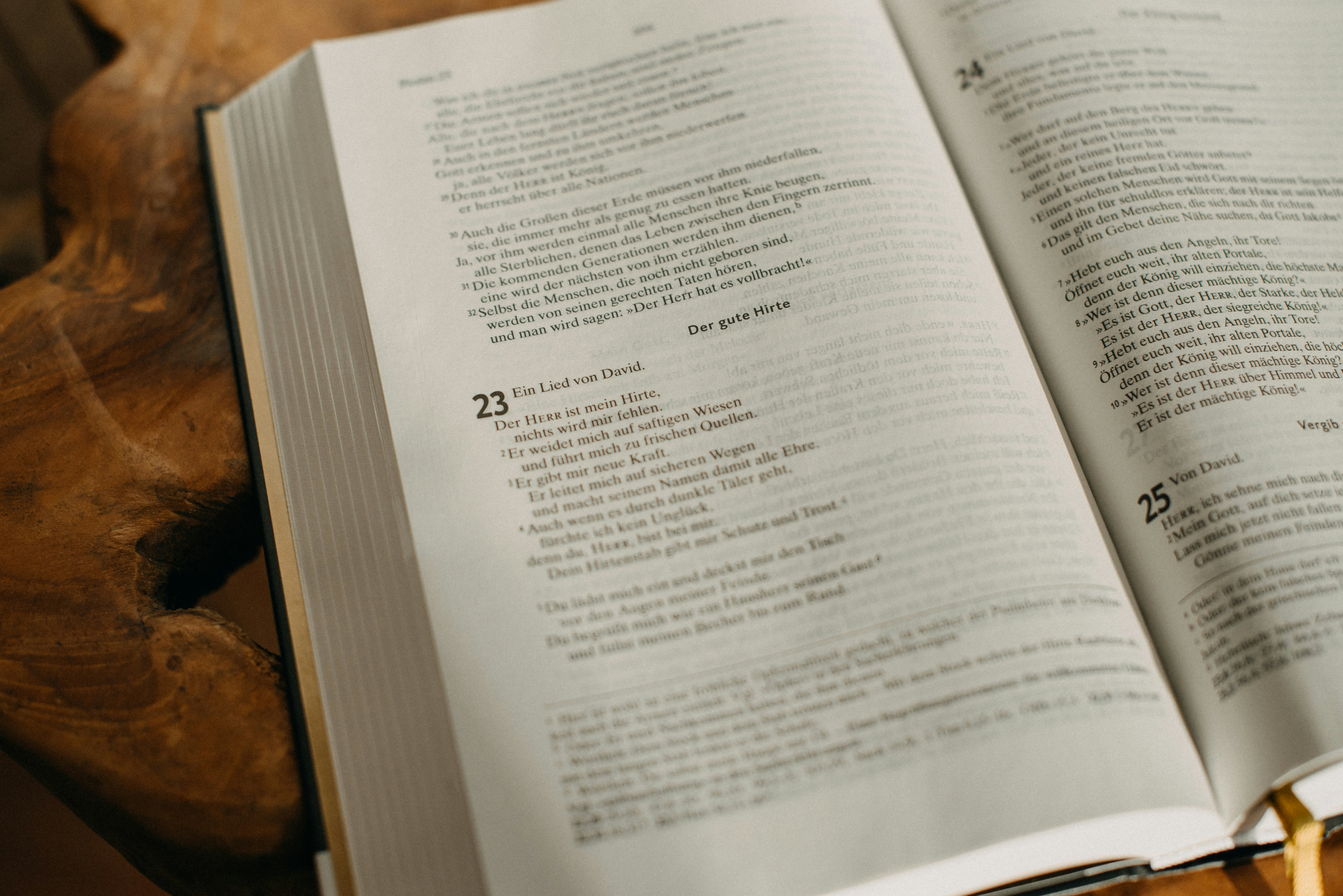 an open book sitting on top of a wooden table