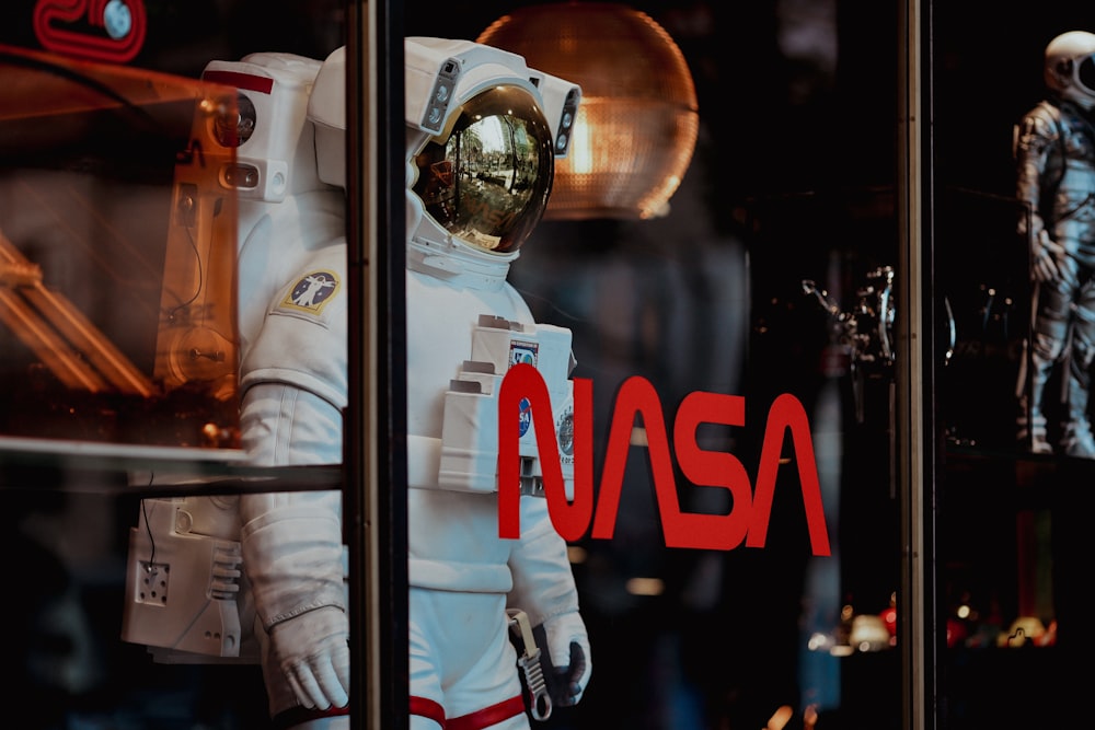 an astronaut suit is displayed in a window