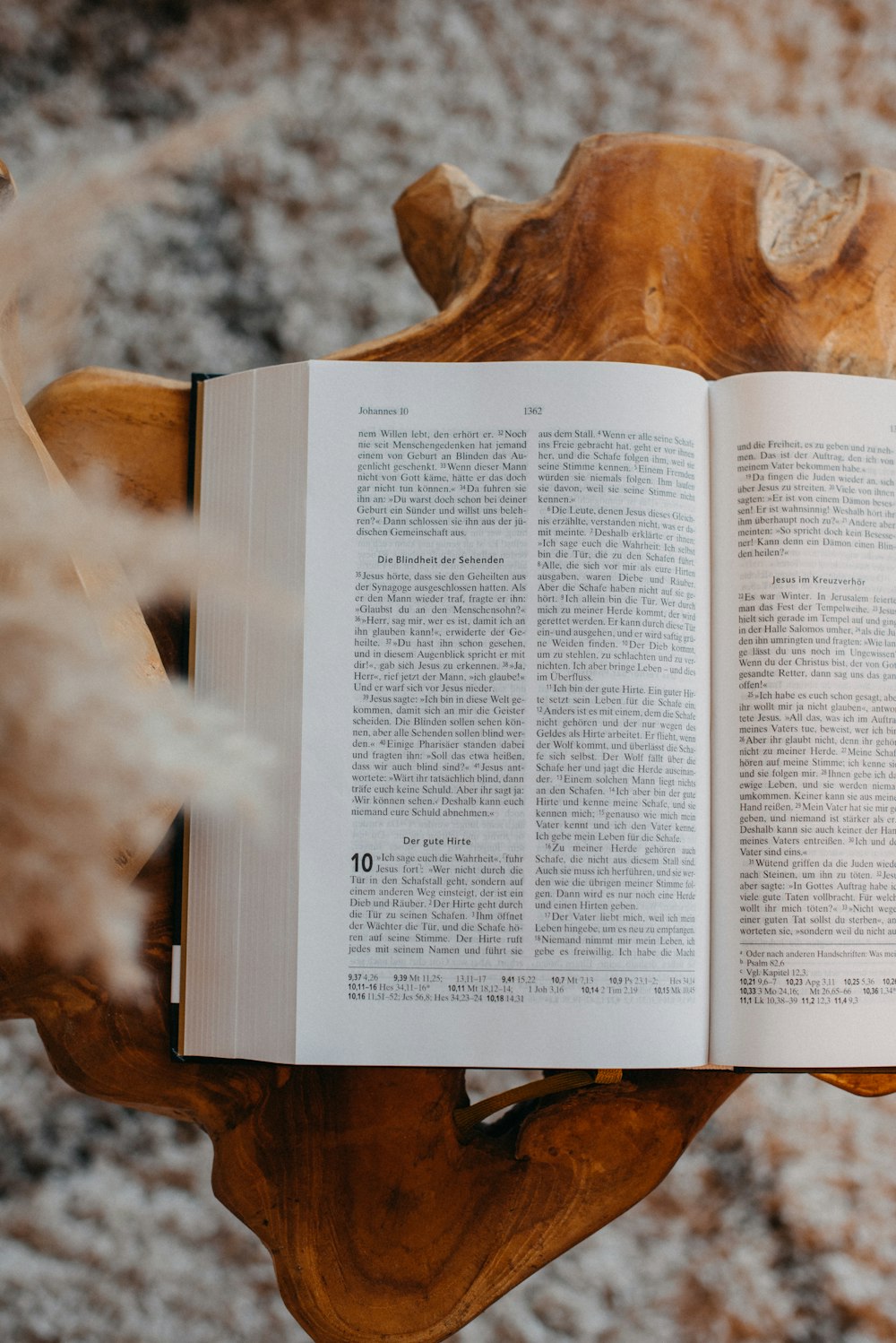 an open book sitting on top of a wooden table