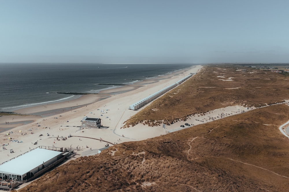 an aerial view of a sandy beach and ocean