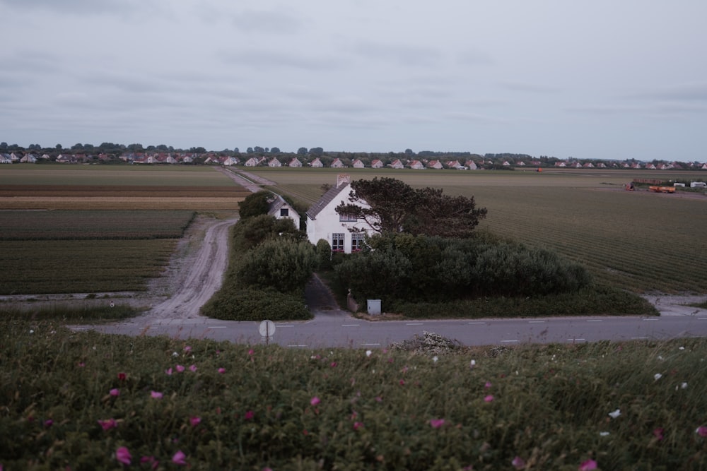 a house in the middle of a field