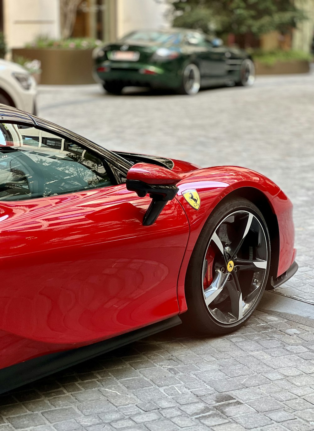 a red sports car parked on the side of the road