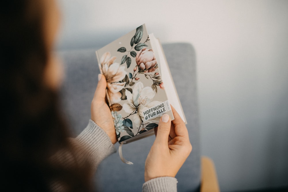 a woman holding a book in her hands