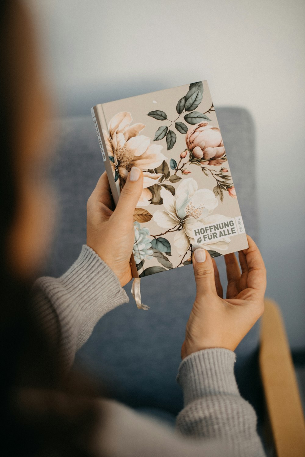 a person holding a book in their hands