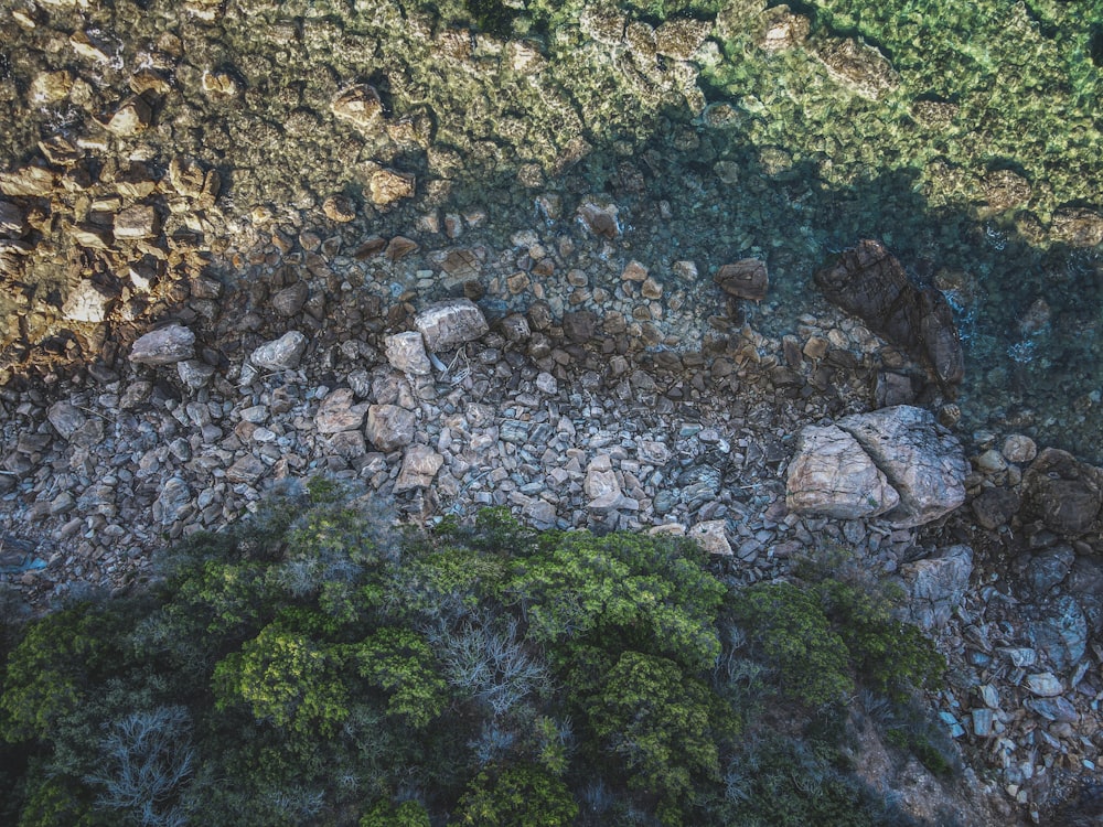 an aerial view of rocks and grass