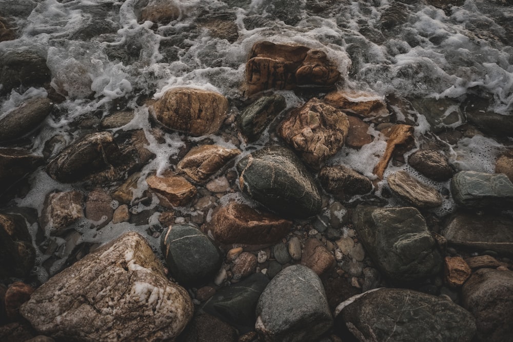 a bunch of rocks that are in the water