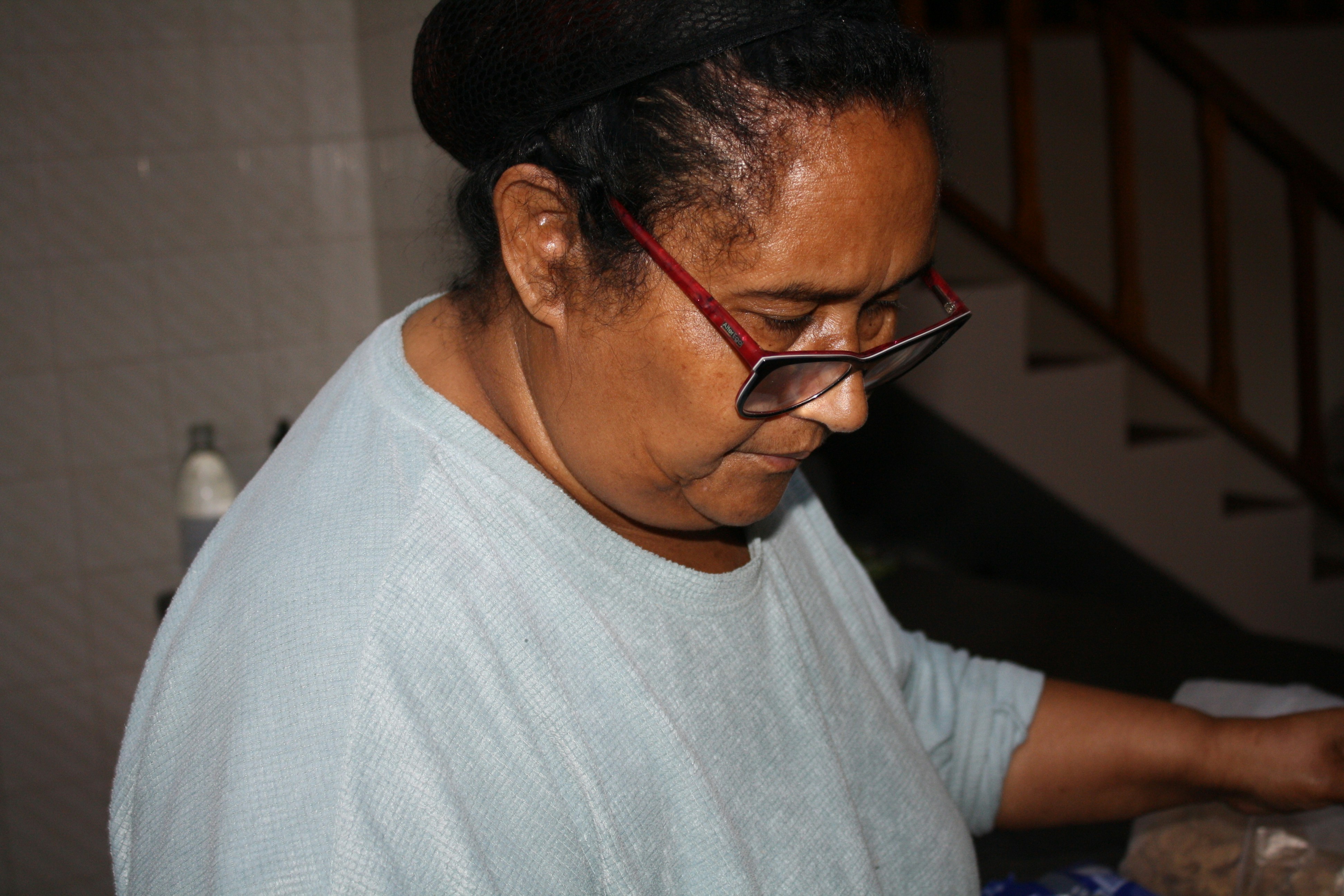 Volunteer helping a senior with home maintenance tasks - community help for elderly