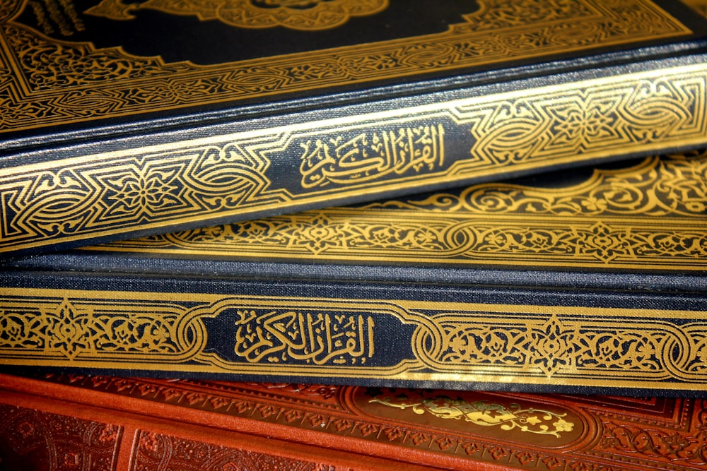 a close up of three books on a table