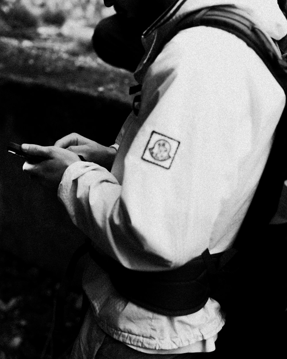 a black and white photo of a man smoking a cigarette