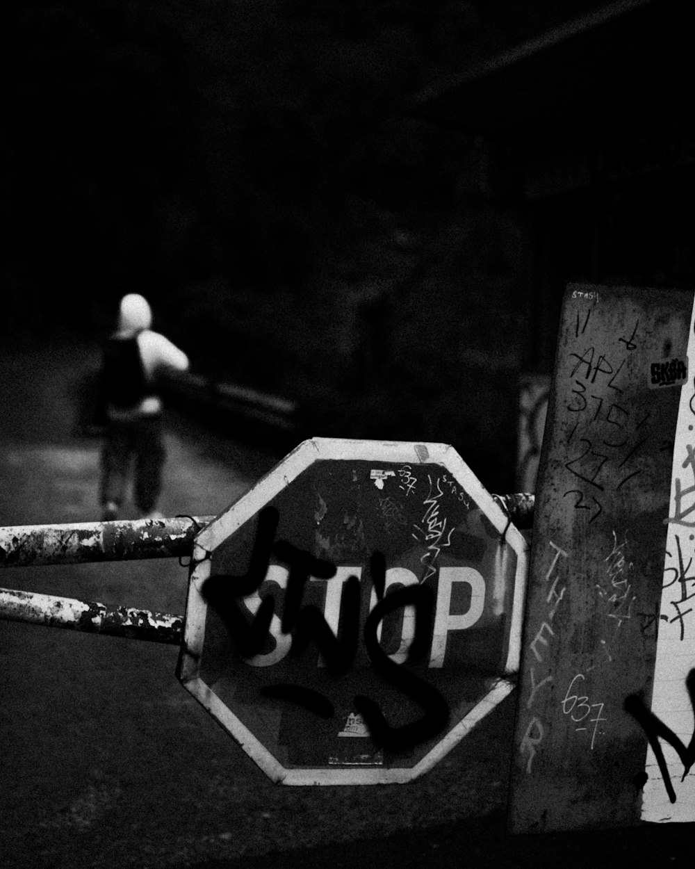 a stop sign that has been vandalized with graffiti