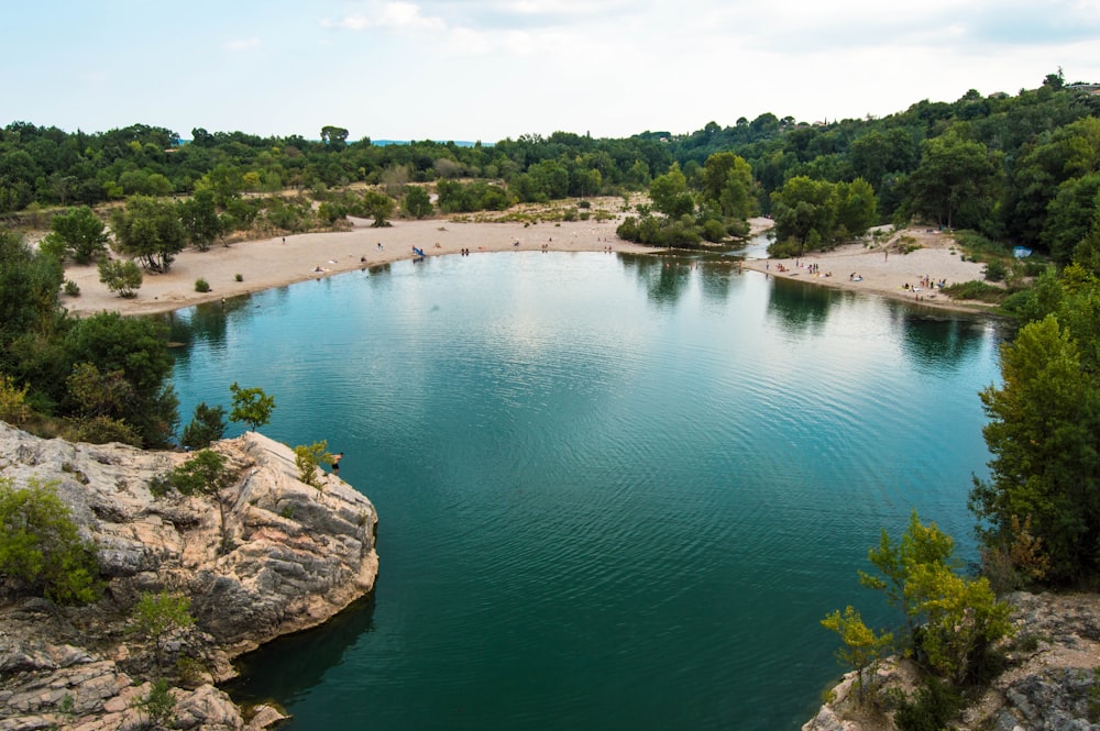 a body of water surrounded by trees and rocks