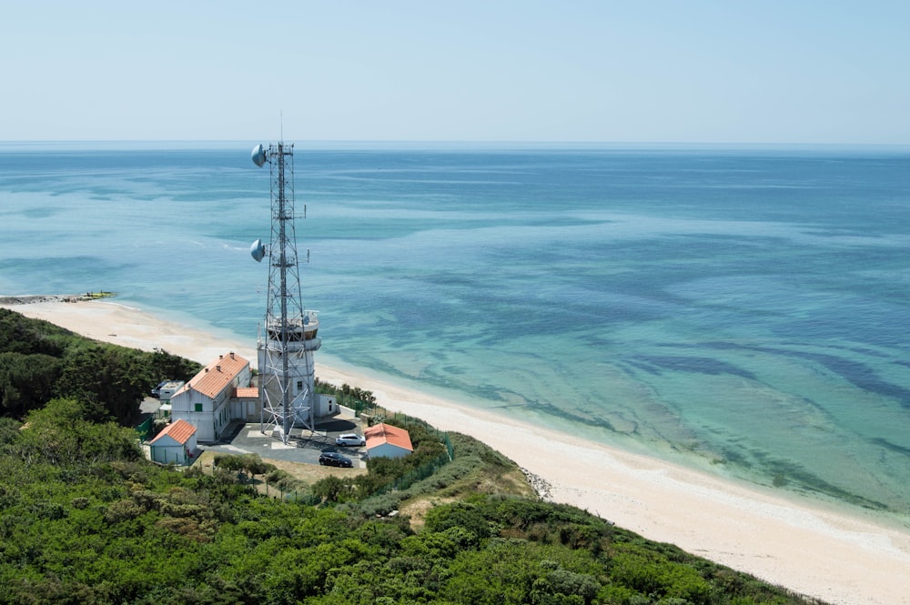 a tower on top of a hill near the ocean