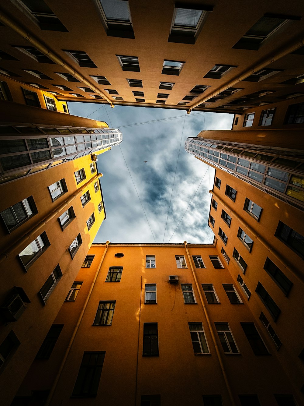 looking up at tall buildings from the ground