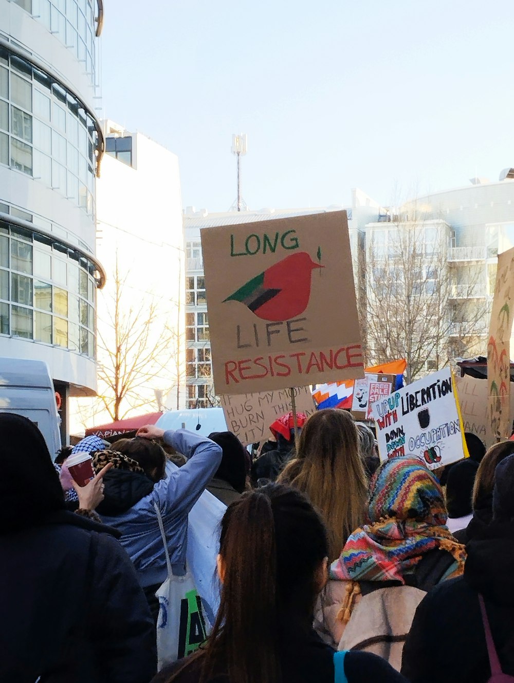 a group of people holding signs in a protest