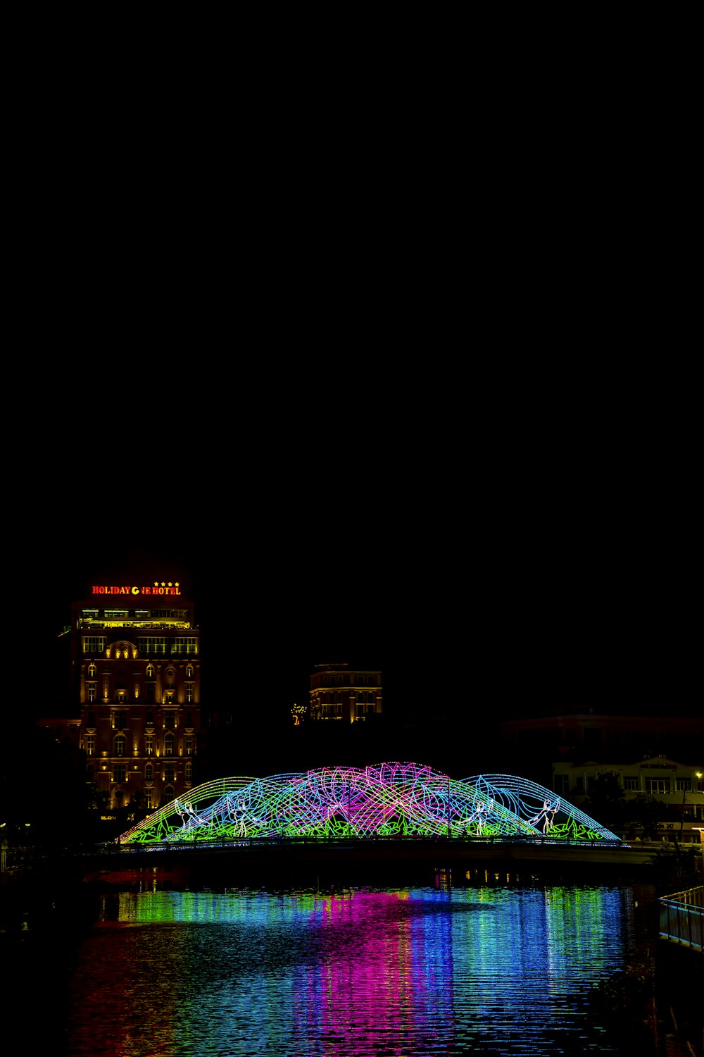 a bridge that is lit up at night