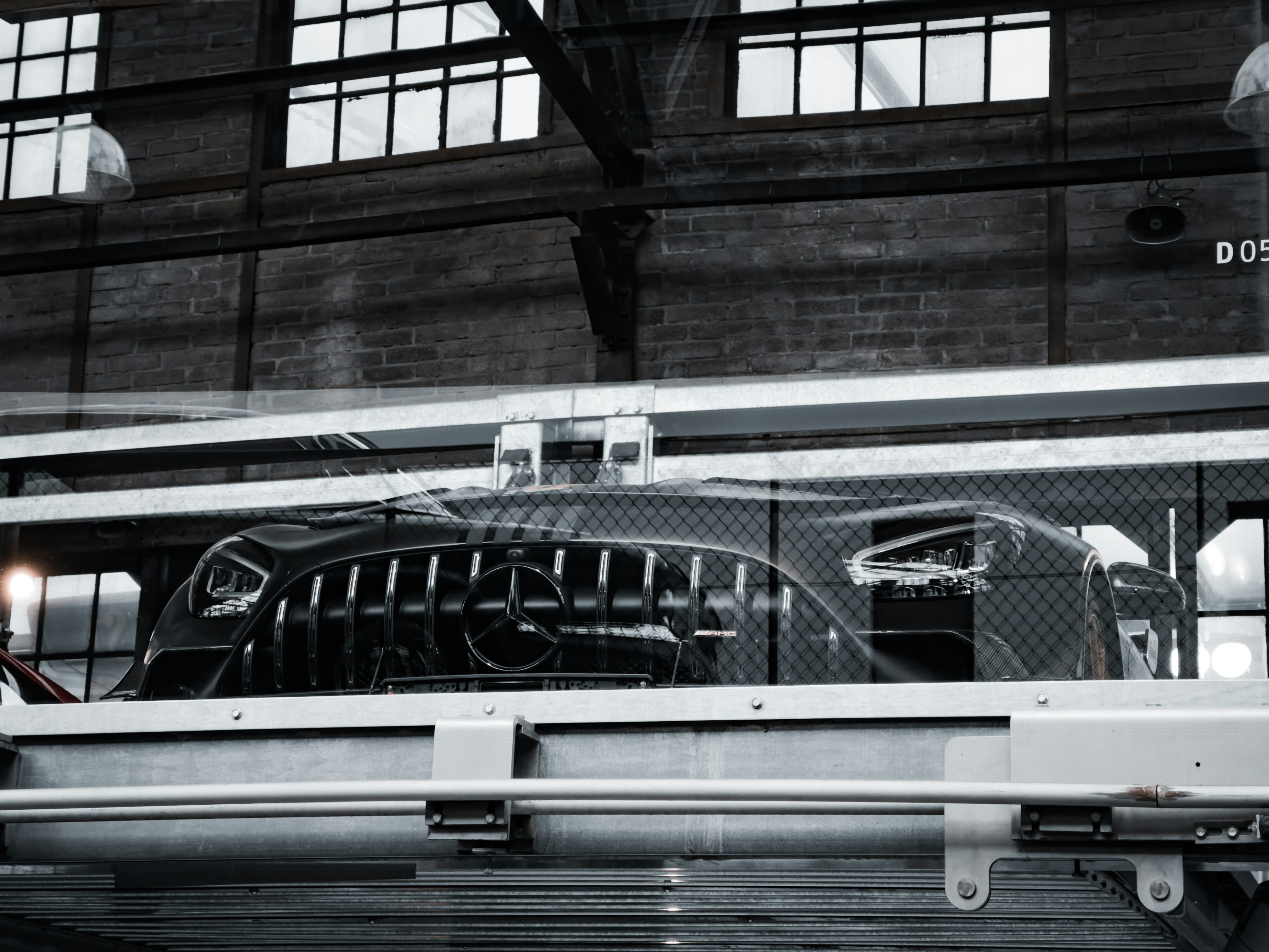 a black and white photo of a train in a train station