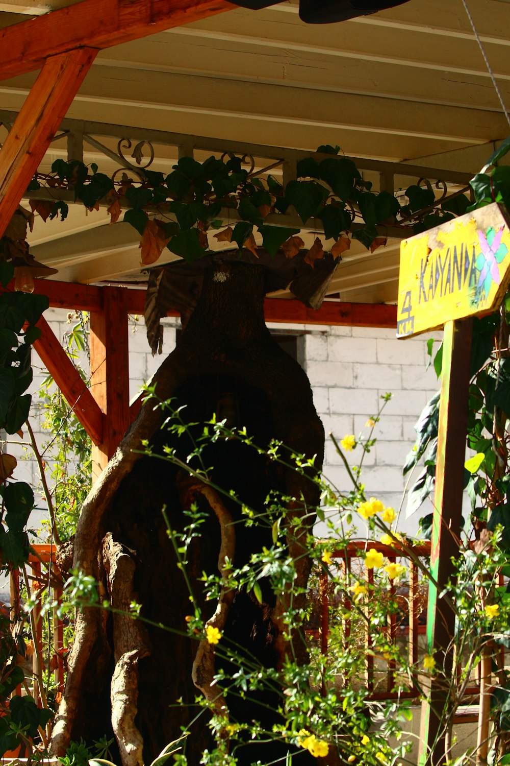 a statue of a bear in the middle of a garden