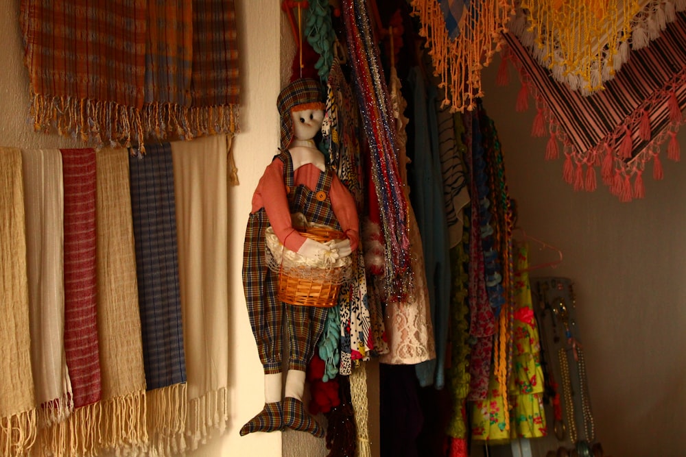 a room filled with lots of different types of scarves
