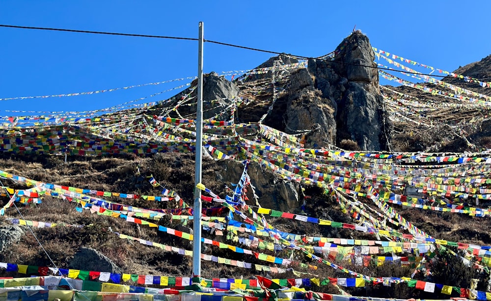 a mountain covered in lots of colorful flags