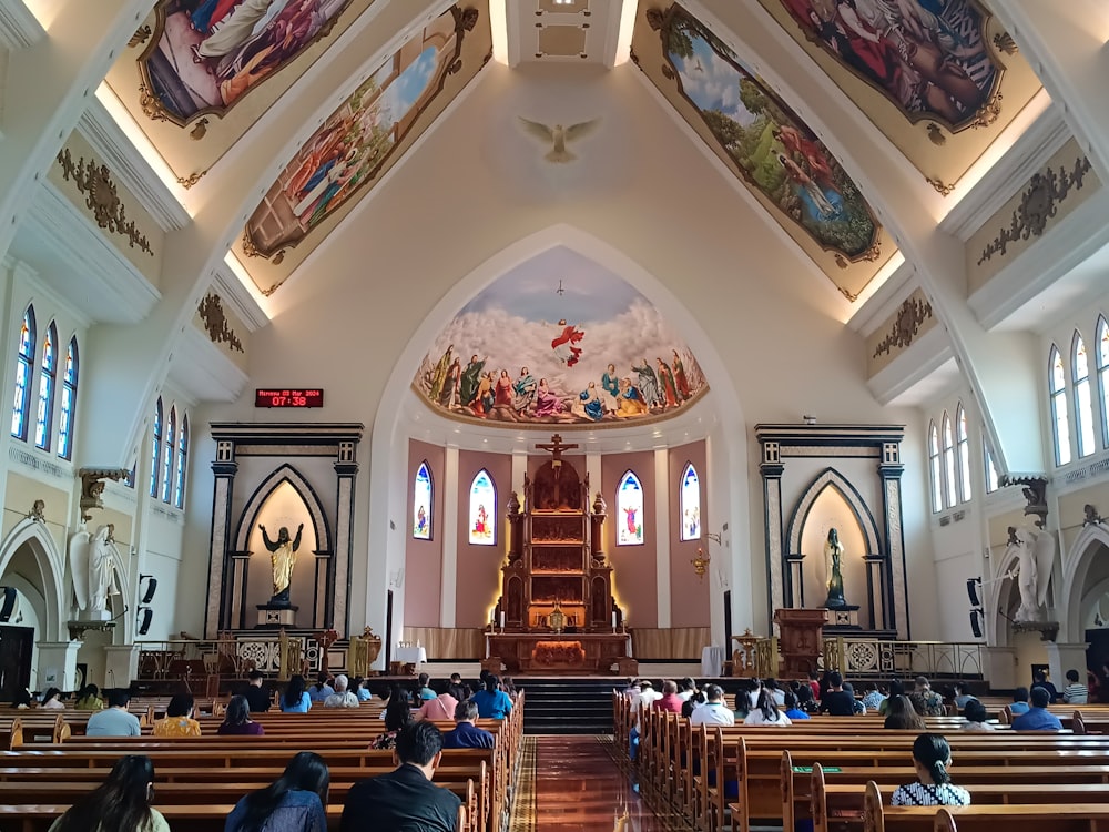 a church filled with lots of people sitting down