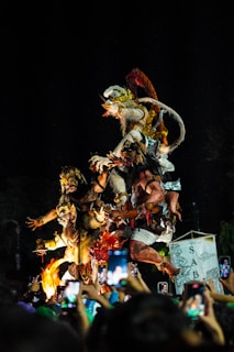 a group of people that are standing in the dark