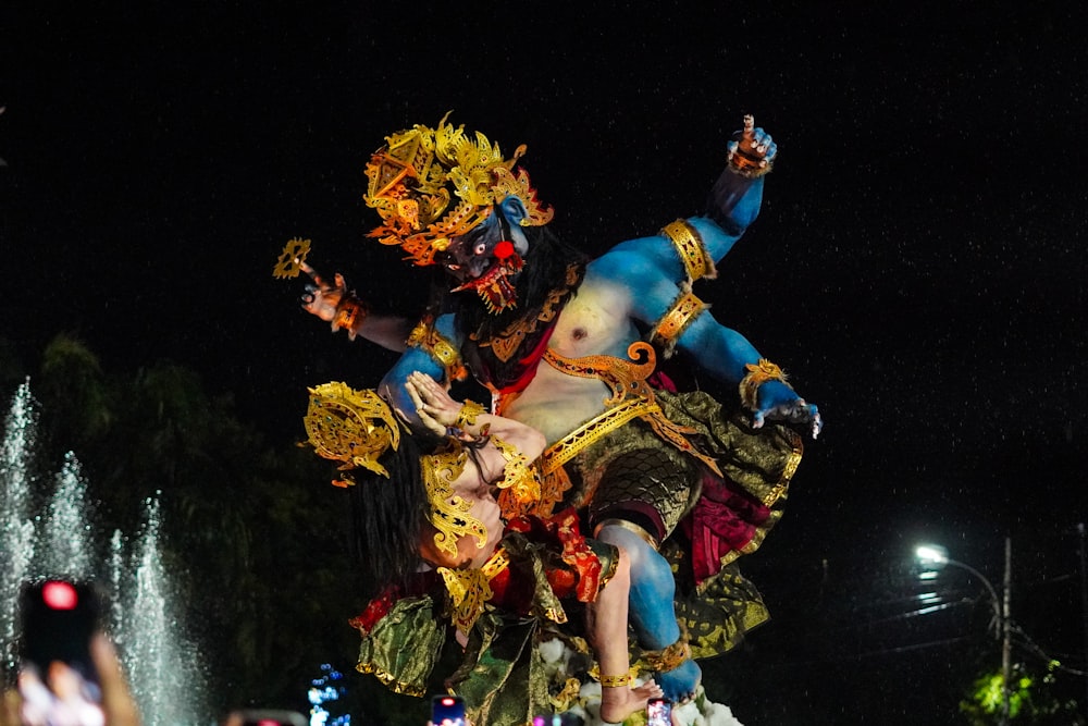 a statue of a man riding a horse in a parade