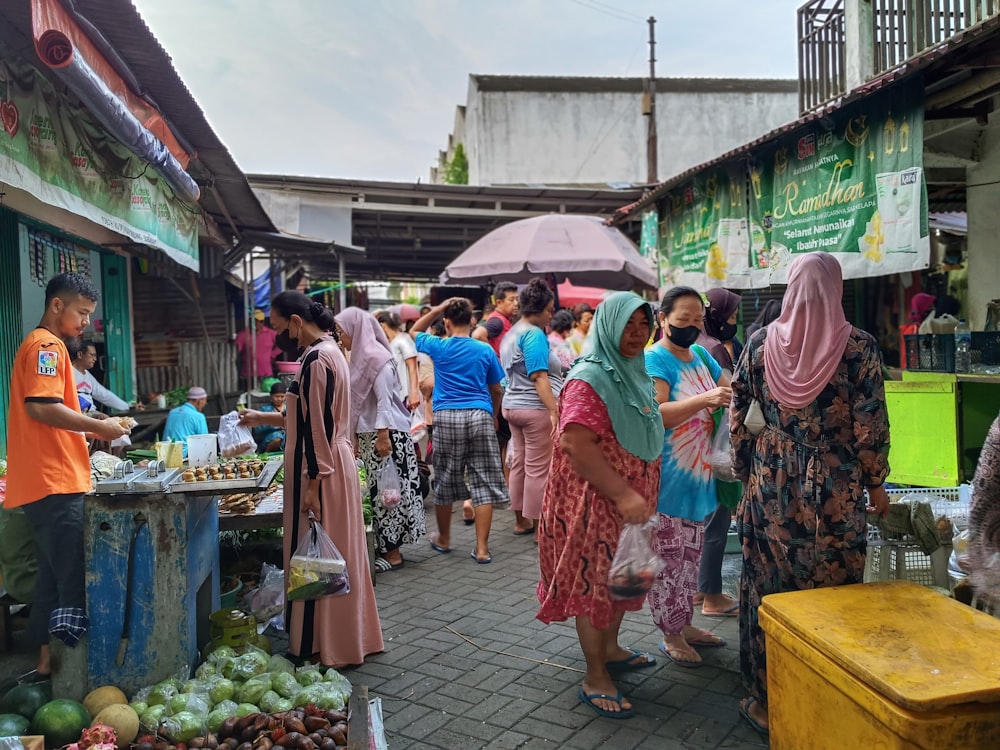 a group of people standing around a market