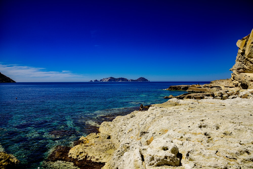 a view of a body of water with a mountain in the background