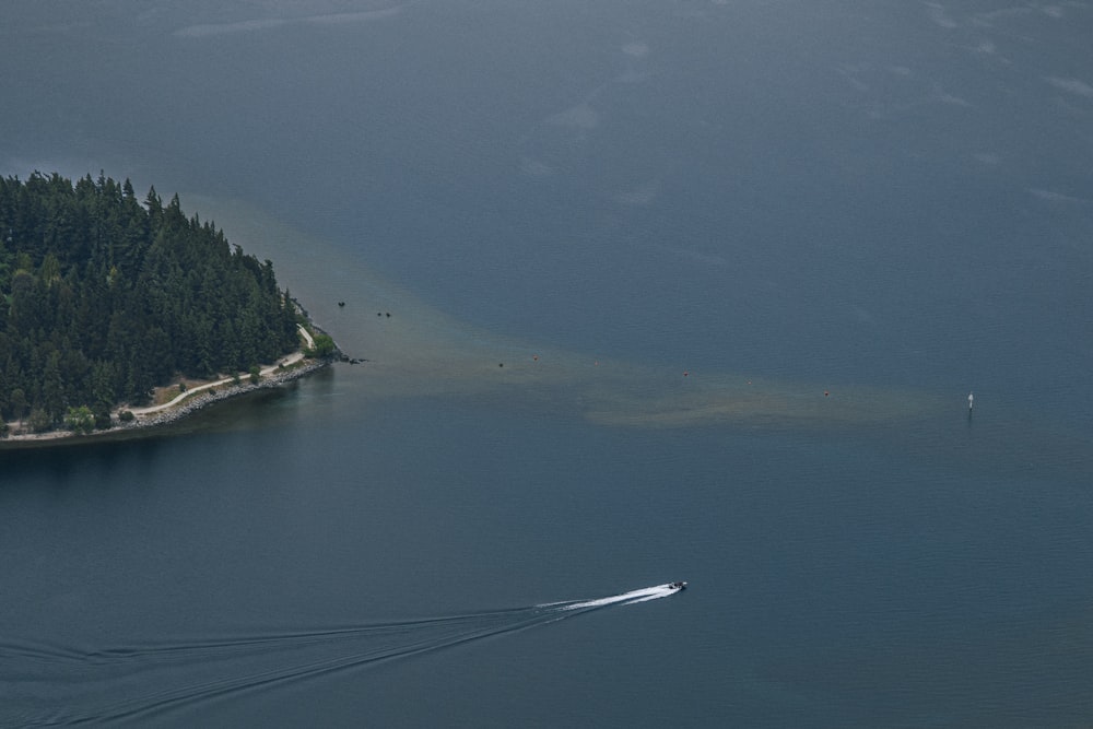 a boat traveling across a large body of water