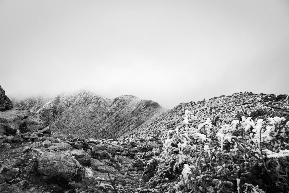 a black and white photo of a rocky mountain