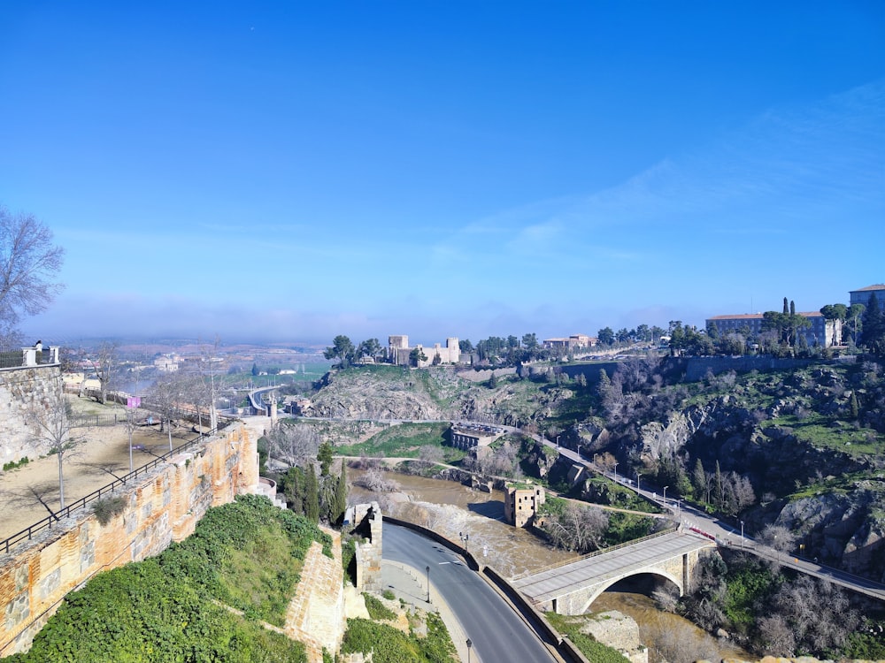 a scenic view of a road and a bridge