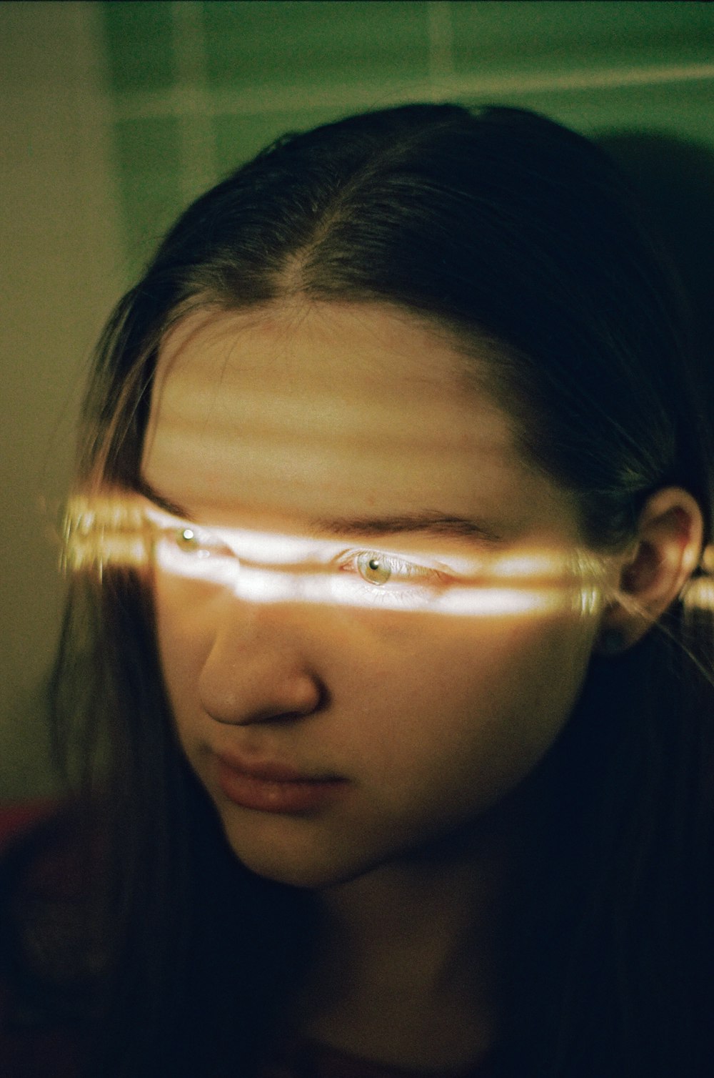 a woman looking at her reflection in a mirror