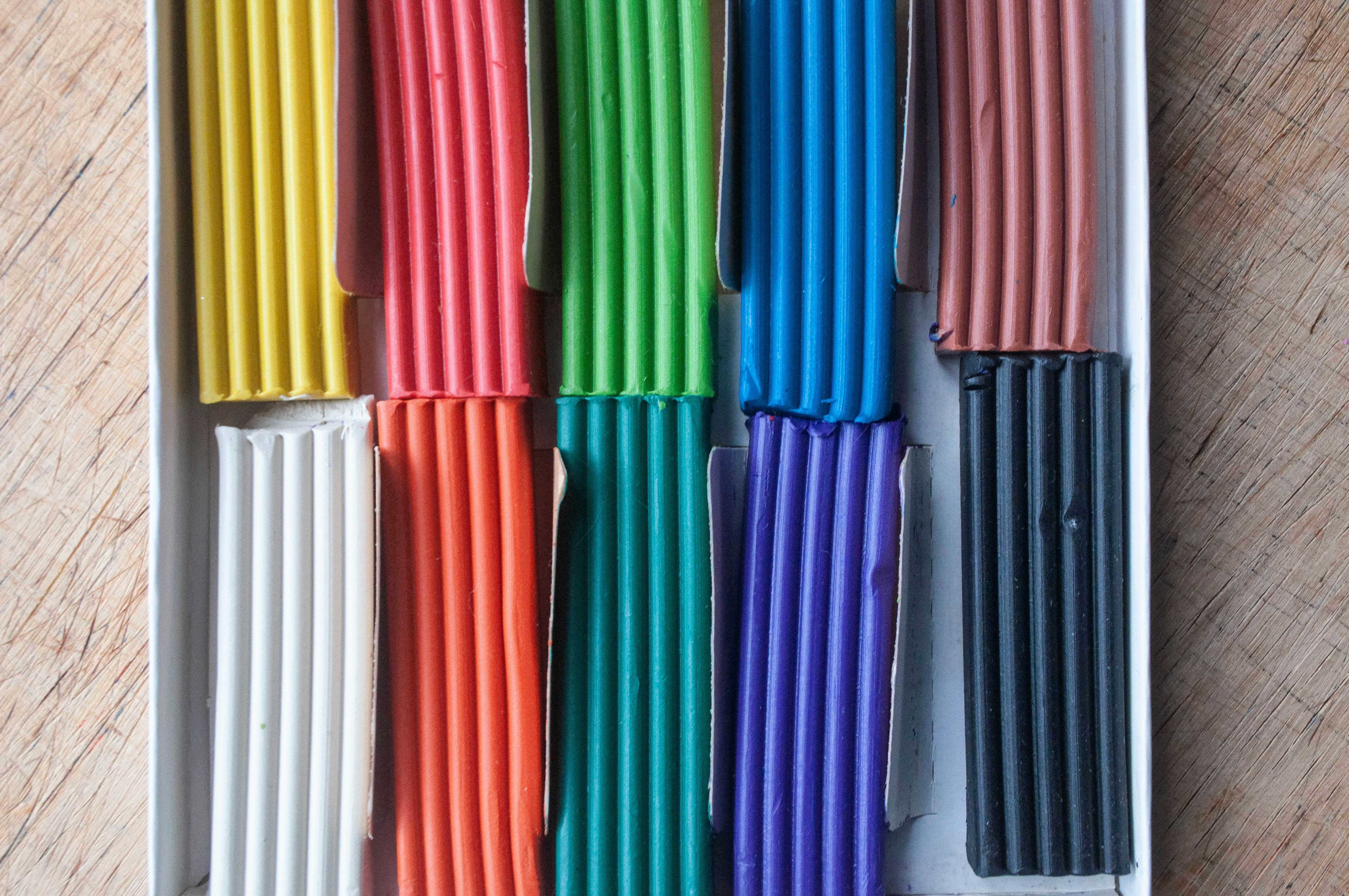 a box filled with lots of different colored sticks