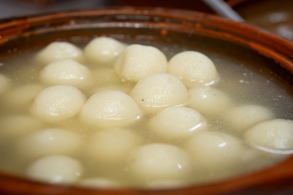 a wooden bowl filled with a mixture of food