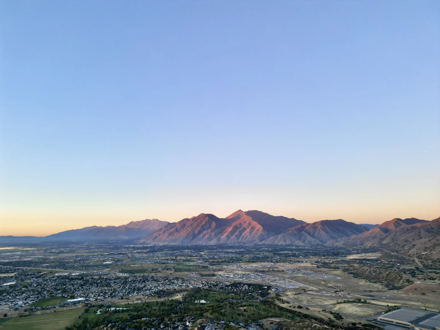Aerial view of a Utah valley town and the mountains beyond