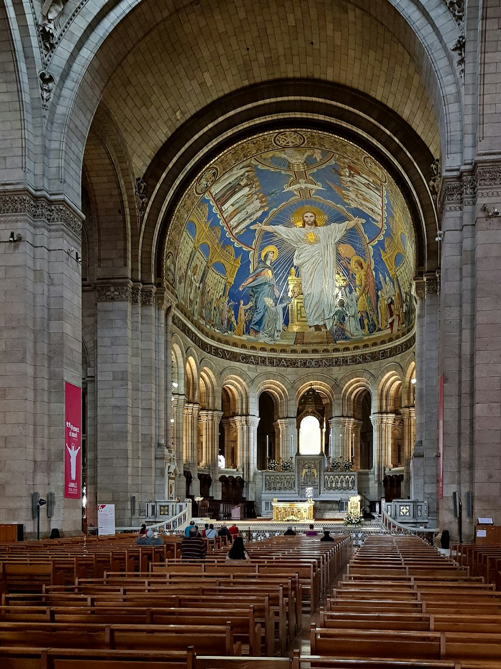 a large church with a painting on the ceiling